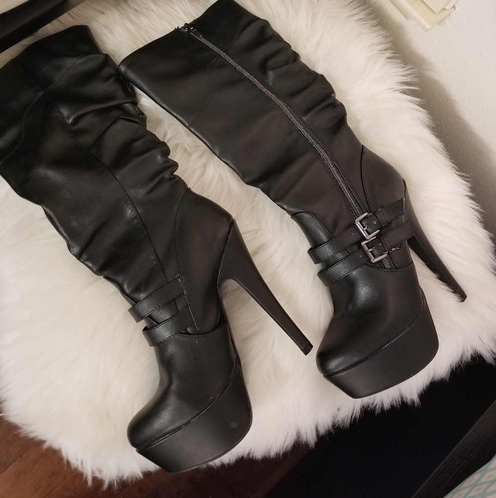 Knee-length black heeled boots